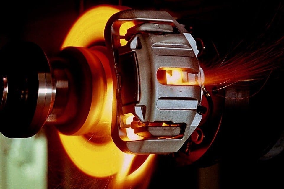 How does a friction pad help EVs brake?